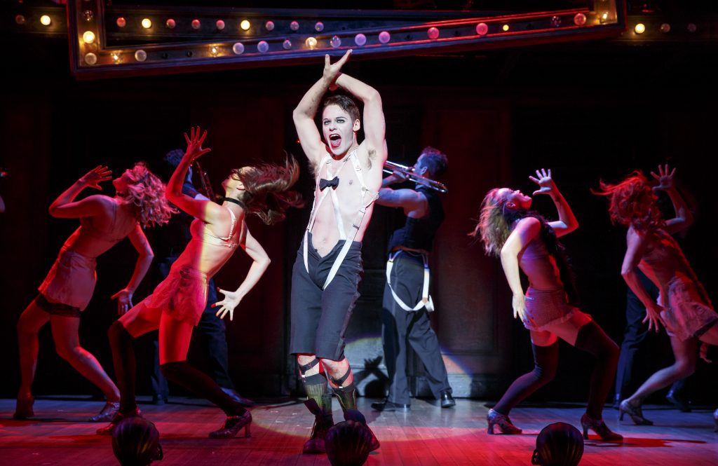 Cabaret Providence Performing Arts Center CABARET Book by Music by Joe Masteroff John Kander Based on the play by JOHN VAN DRUTEN and stories by CHRISTOPHER ISHERWOOD starring Randy Harrison Andrea Goss Shannon Cochran Alison Ewing Mark Nelson Ned Noyes Kelsey Beckert Sarah Bishop Margaret Dudasik Hillary Ekwall Lori Eure Andrew Hubacher Set Design by Robert Brill Orchestrations Michael Gibson Hair & Wig Design Paul Huntley Technical Supervisor Larry Morley Associate Managing Director Steve Dow Executive Producer Sydney Beers Lee Aaron Rosen Aisling Halpin Leeds Hill Joey Khoury Tommy McDowell Evan D. Siegel Dani Spieler Steven Wenslawski Musical Supervisor/Vocal Arrangements Patrick Vaccariello Associate Choreographer & Choreography Recreated by Cynthia Onrubia Directed by BT McNicholl Originally Co-Directed & Choreographed by Rob Marshall Originally Directed by Sam Mendes Costume Design by William Ivey Long Dance & Incidental Music David Krane Casting Jim Carnahan, C.S.A. Jillian Cimini, C.S.A. Tour Booking Agency The Booking Group Meredith Blair Director of Marketing & Audience Development Robert Sweibel General Manager Richards/Climan, Inc. Lighting Design by Peggy Eisenhauer Mike Baldassari Music Director Robert Cookman Production Stage Manager John M. Atherlay Press & Marketing Direction Type A Marketing Director of Development Lynne Gugenheim Gregory Sound Design by Keith Caggiano Based on the Original Broadway design by Brian Ronan *Generously underwritten by Margot Adams, in memory of Mason Adams Roundabout Theatre Company is a member of the Broadway League and League of Resident Theatres. RoundaboutTheatre.org National Tour Launch: January 26 - 31, 2016 Lyrics by Fred Ebb Founding Director Gene Feist Adams Associate Artistic Director* Scott Ellis Emcee.............................................................................................................................. RANDY HARRISON The Kit Kat Girls: Rosie .......................................